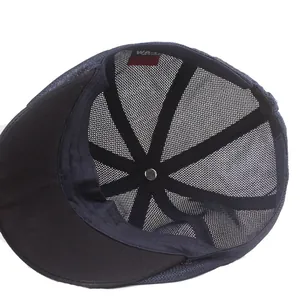 Dark blue breathable mesh flat cap showing inner sweatband and structural reinforcement