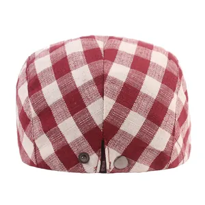 Classic red and white gingham flat cap with metal buckle on a clean white background