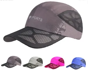 Detail view of quick-dry mesh baseball caps in multiple colors with sports embroidery