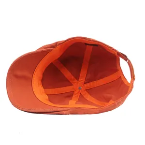 Vue intérieure d'un béret réglable en coton orange brûlé avec bandeau de confort
