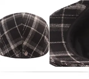 Detail view of plaid newsboy cap showing textured wool fabric and metal side button