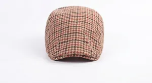 Close-up of retro striped beret showing brown houndstooth pattern and wool texture