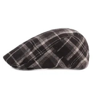 Close-up of classic black and grey plaid wool flat cap with refined stitching detail