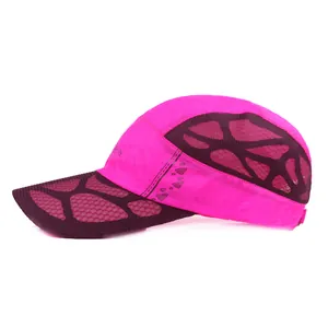 Detail of pink breathable mesh fabric and SPORTS print on the lightweight running cap