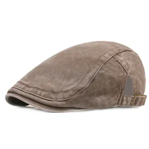 Retro washed brown newsboy cap with adjustable metal buckle on a white background