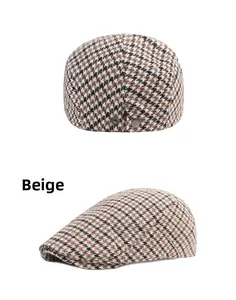 Macro detail of beige houndstooth beret showing back profile and metal buckle adjustment