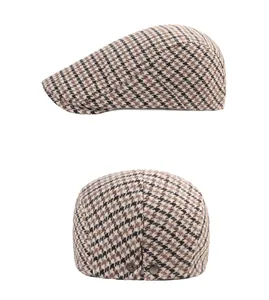Dual view of vintage houndstooth flat cap featuring side metal buttons and textured fabric