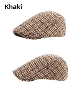 Detail of khaki plaid tweed newsboy cap fabric texture and classic vintage stripe pattern