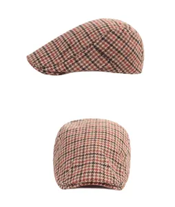 Detail of vintage striped beret showing brown plaid tweed fabric and top-down view
