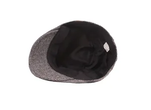 Detail of wool blend herringbone beret showing interior lining and care label with size 58