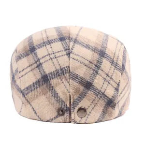 Winter wool plaid flat cap with bronze buckle detail in British vintage style