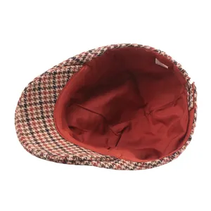 Vintage wool blend flat cap with retro houndstooth pattern in brown and red colors