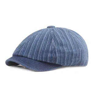 Detailed view of the striped denim texture and stitching on this vintage flat cap