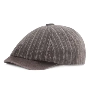 Detailed view of striped vintage newsboy cap fabric texture and stitching details