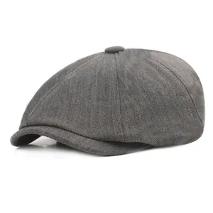 Gros plan détaillé sur la texture à chevrons gris foncé d'une casquette vintage