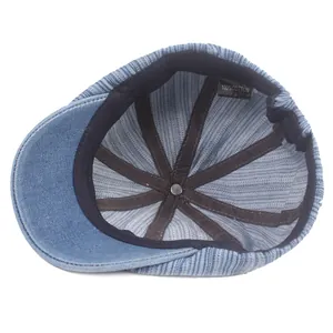 Blue denim striped flat cap interior showing 100% cotton material and fine stitching
