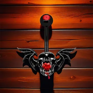 Piercing de nombril gothique avec crâne noir, ailes de chauve-souris et pierre rouge