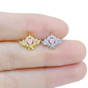 Exquisite stainless steel heart and wing piercing studs with pink zircon and bow detail