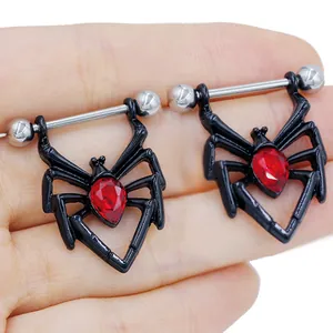 Close-up of black spider nipple rings with red teardrop gems and stainless steel bars