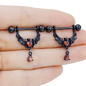 Gothic black bat nipple ring with red heart gem and teardrop pendant detail