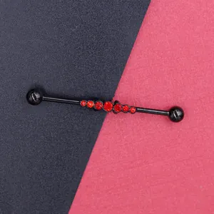 Macro view of black industrial barbell with seven sparkling red crystals on the steel bar