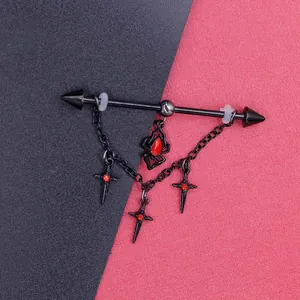 Detail of gothic black industrial barbell featuring red spider and cross charm dangles