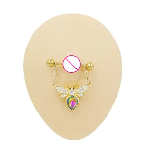 Detailed view of a gold bee nipple ring with AB zircon teardrop stone on silicone model