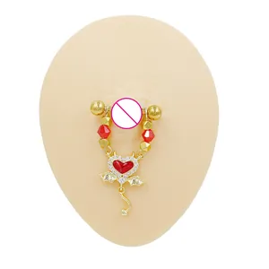 Detail of golden nipple ring with red crystal heart pendant and beaded chain accent