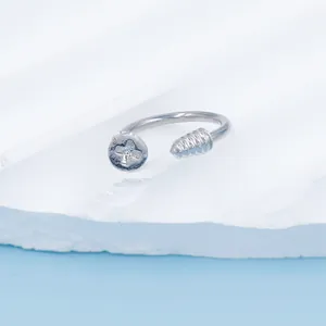 Macro view of silver stainless steel horseshoe ring with screw head and pointed ends