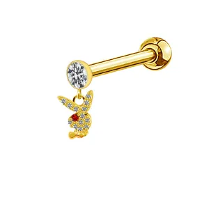 Detailed view of golden piercing stud with a crystal-encrusted bunny pendant and bow