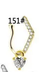 Close-up of gold-plated U-shaped nose ring with heart zircon and crystal stones