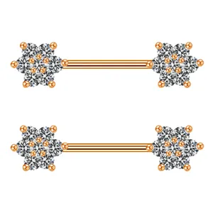 Macro detail van roségouden bloem tepelringen met fonkelende zirkonia edelstenen