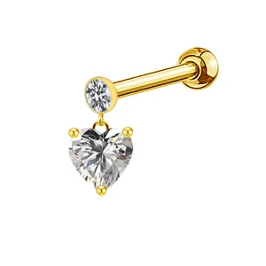 Macro view of gold heart crystal labret with three-prong setting and zircon stud detail