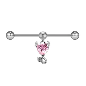 Detailed macro of pink heart devil gemstone on a silver stainless steel piercing bar