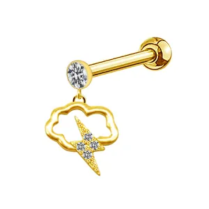 Detail shot of golden cloud stud earring with lightning bolt and sparkling crystals