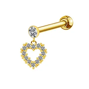 Detailed macro of gold heart labret stud with crystal inlay and flat back design