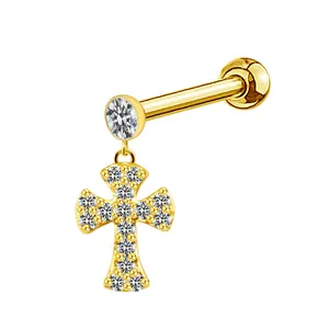 Detailed view of a gold-plated cross dangle earring featuring pavé-set shimmering crystals