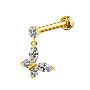 Detailed close-up of golden butterfly stud earring with sparkling crystal zircon inlay