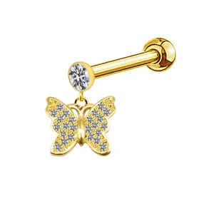 Detailed view of golden butterfly stud earring with sparkling white cubic zirconia stones