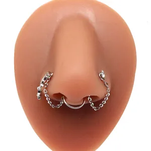 Detail of stainless steel heart nose ring chain with rhinestones on silicone model