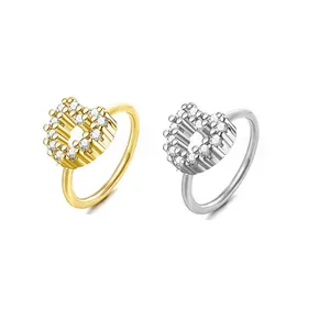 Minimalist gold and silver heart-shaped nose rings with pave cubic zirconia accents
