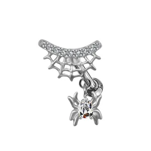 Detailed close-up of a silver spider web navel piercing with sparkling pear-cut zircon