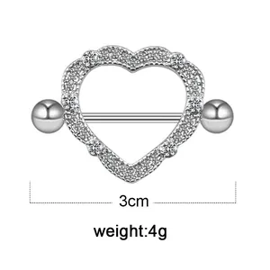 Detail of silver heart-shaped nipple ring with sparkling rhinestones, 3cm width and 4g weight