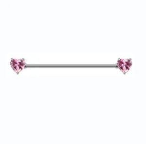 Macro detail of industrial barbell earring with pink heart stones and stainless steel rod