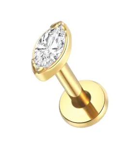Macro view of marquise-cut crystal labret stud with polished gold-plated flat back base