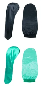 Detail of long satin hair bonnets in black and teal with elastic bands for long hair