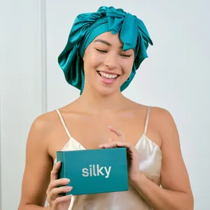 Deep teal silk satin hair bonnet with bow and premium packaging box for hair protection