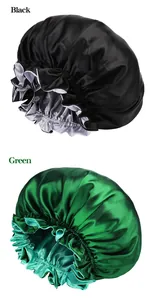 Detail of satin sleeping caps in black and green with wide elastic bands