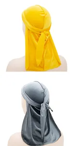 Rear view of velvet durags in yellow and grey showing the long tail and tie detail