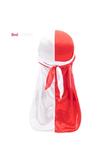 Detail of red and white silky durag showing long tail knot and satin fabric texture